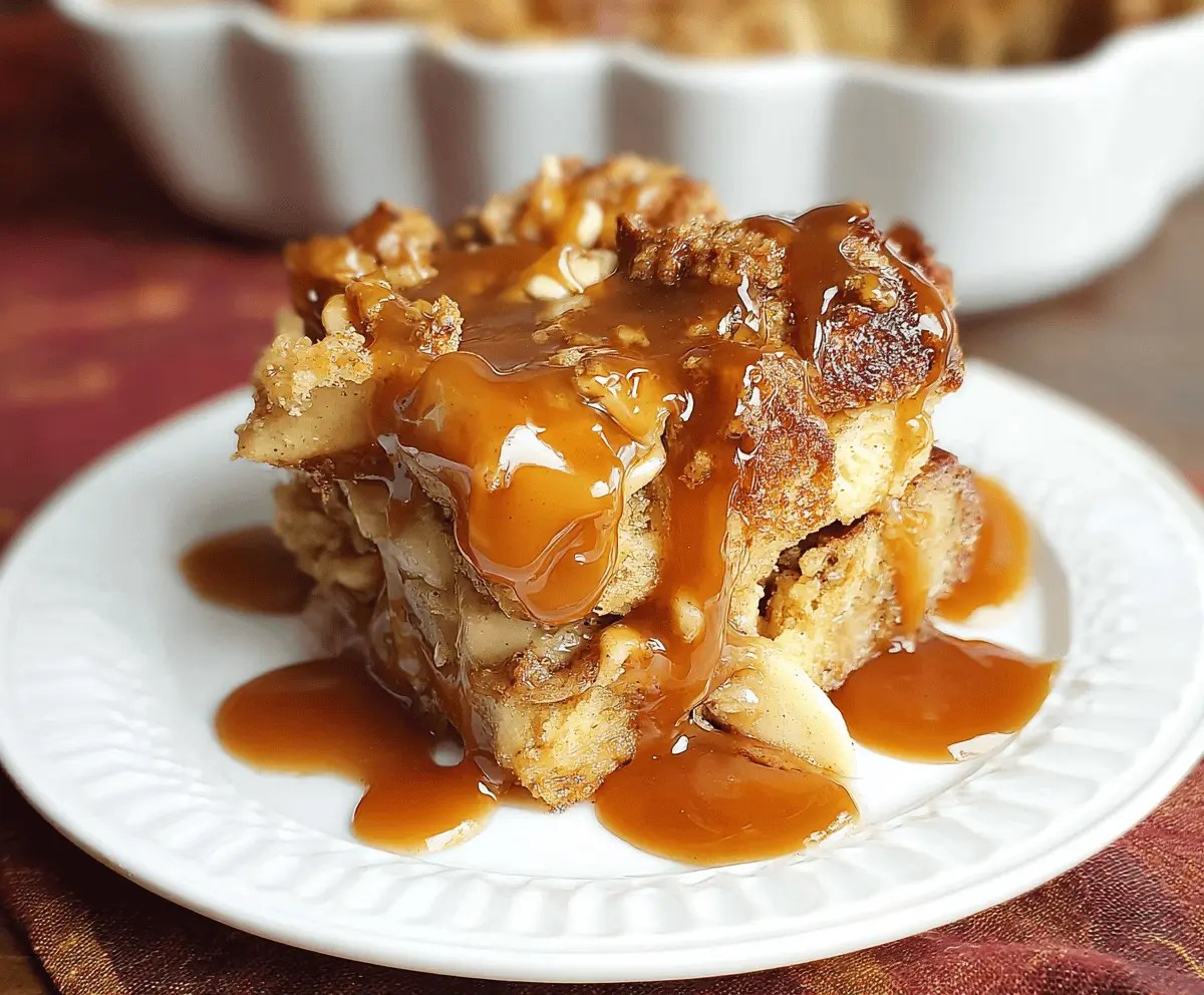 Delicious caramel apple bread pudding topped with caramel sauce and fresh apple slices, served as a warm dessert