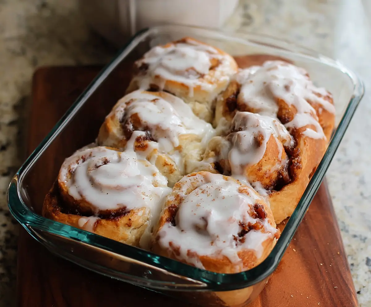 Delicious homemade cottage cheese cinnamon rolls with a golden brown exterior and a sprinkle of cinnamon on top.