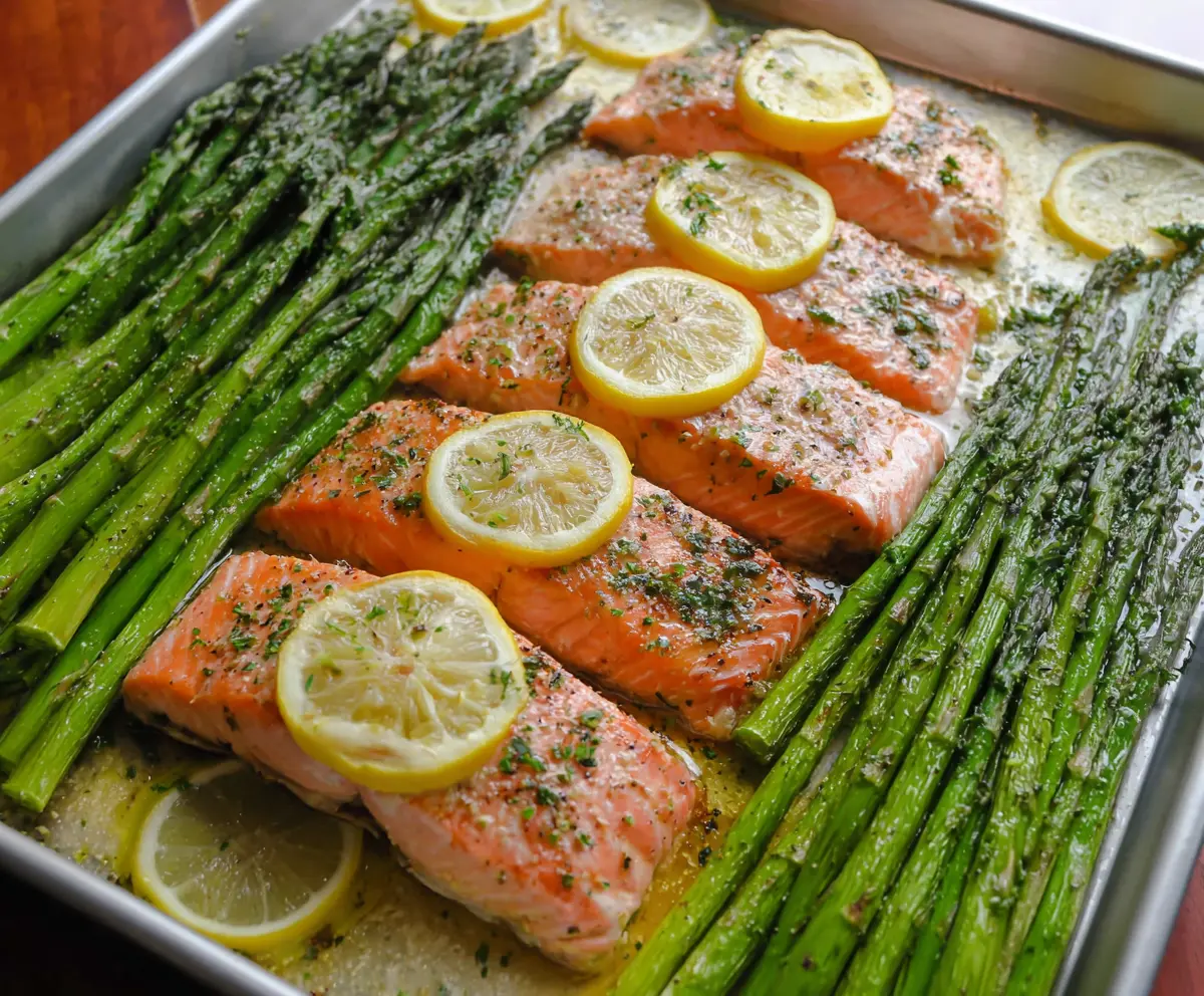 Delicious baked salmon and asparagus on a sheet pan for a healthy dinner.