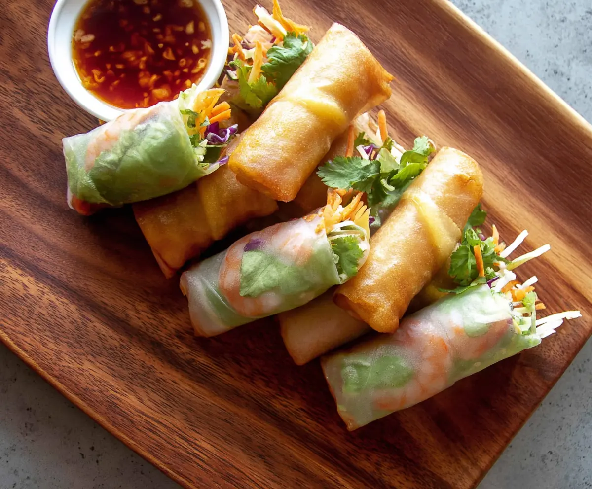 Delicious Shrimp and Pork Spring Rolls with fresh herbs and dipping sauce